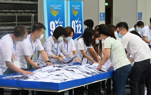 Polling staff opened ballot boxes to begin tallying the results of the Seventh Legislative Assembly
