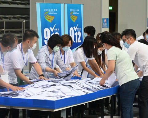Polling staff opened ballot boxes to begin tallying the results of the Seventh Legislative Assembly