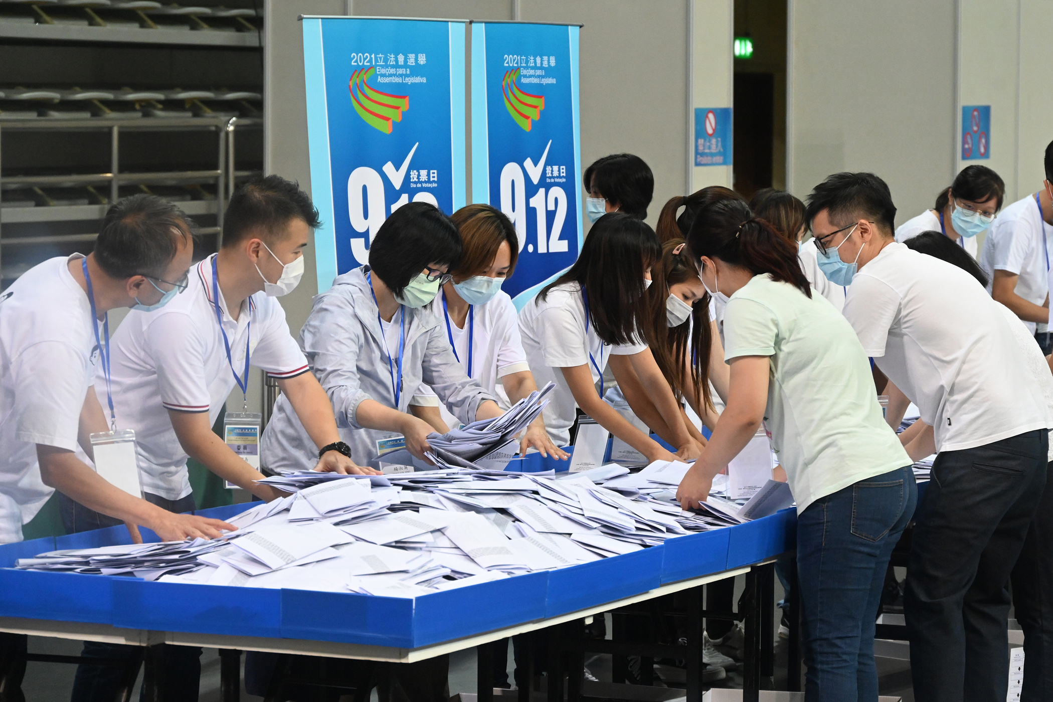 Polling staff opened ballot boxes to begin tallying the results of the Seventh Legislative Assembly