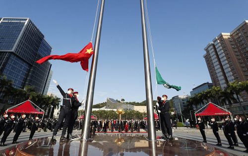A flag-raising ceremony at Golden Lotus Square commemorates the anniversary