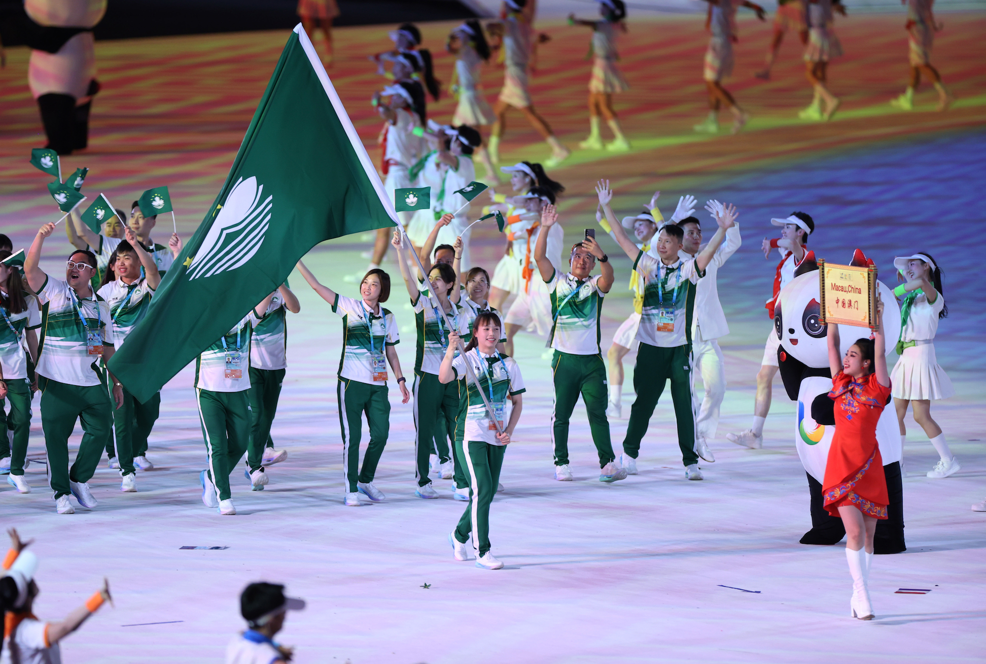 Members of the delegation of China’s Macao march during the opening ceremony of the 31st FISU Summer World University Games in Chengdu