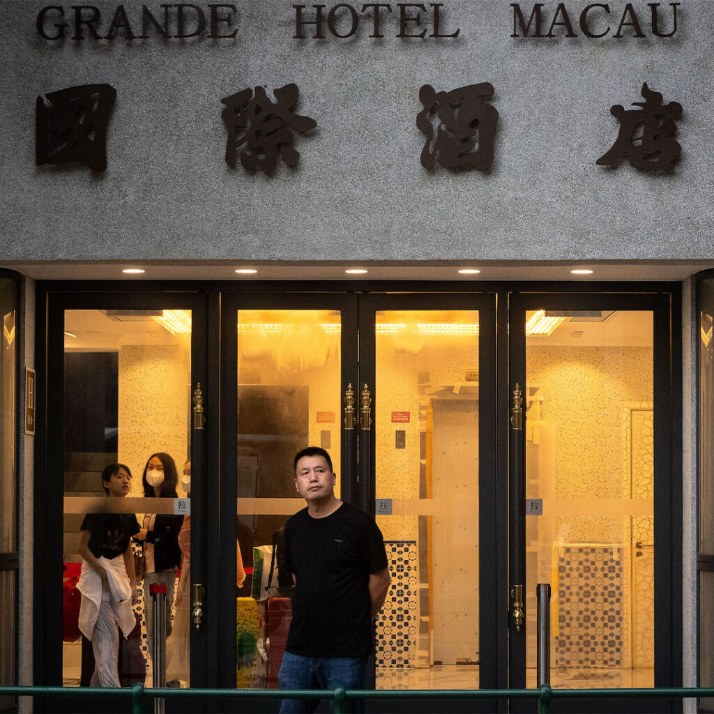 Pondering the past. A guest enjoys a reflective moment at the door of the Grande Hotel