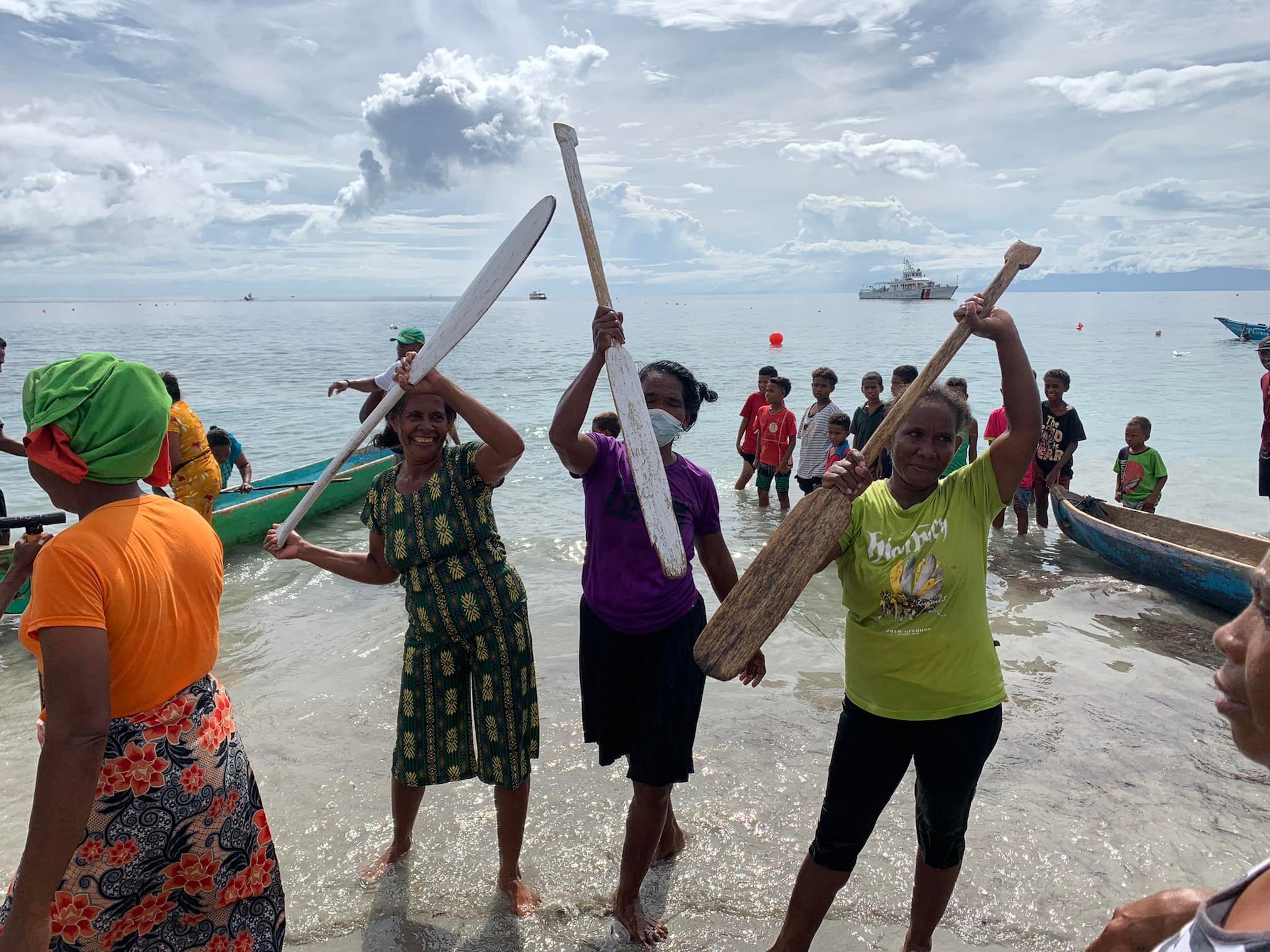 Women in Atauro celebrate their own victory in the paddling race at the First Atauro Festival