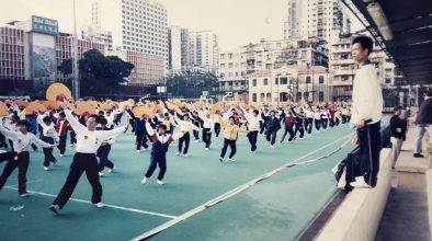 Leong (right) training 1,200 tai chi practitioners at Tap Seac Square for the 1999 handover performance