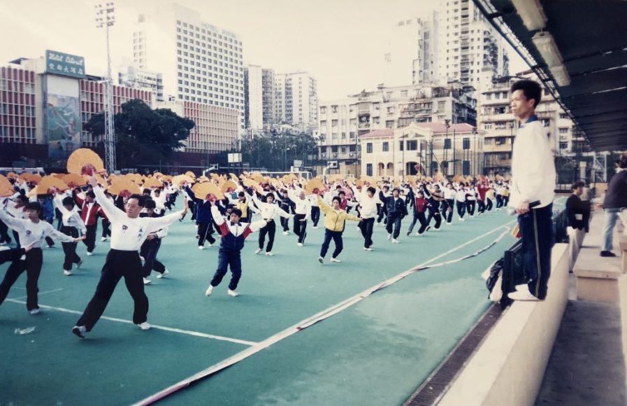 Leong (right) training 1,200 tai chi practitioners at Tap Seac Square for the 1999 handover performance