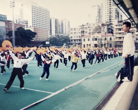 Leong (right) training 1,200 tai chi practitioners at Tap Seac Square for the 1999 handover performance