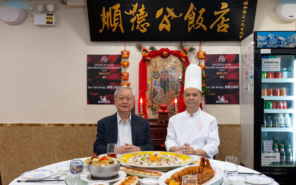 Posters commemorating the restaurant’s Bib Gourmand selection make a fitting backdrop for Sunny Ip Sio Man and the head chef