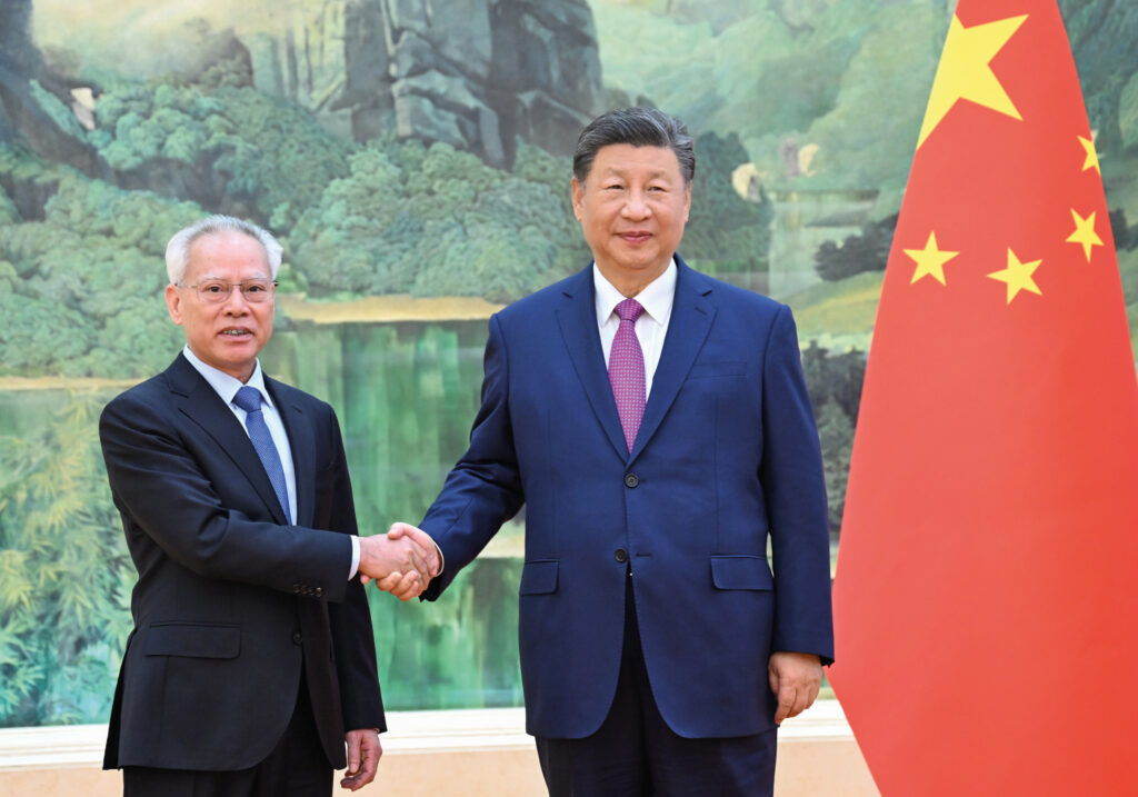 Xi (right) personally congratulated Sam on his appointment