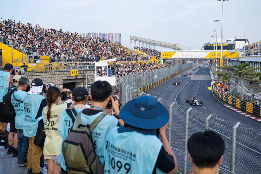 Trackside photographers work their cameras to capture the drama of the FR race