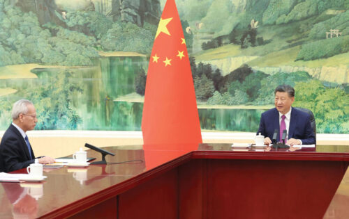 Xi (right) personally congratulated Sam on his appointment