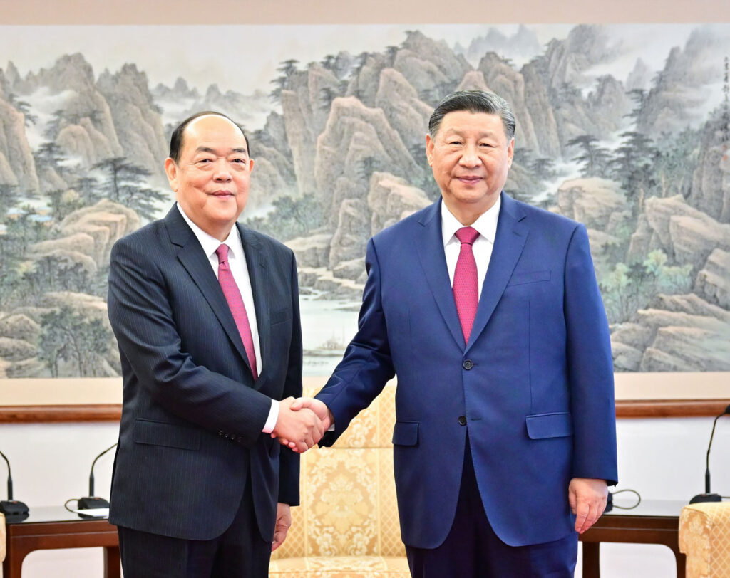 During his time in Macao, Xi inspected the PLA forces stationed at Taipa and commended Ho Iat Seng (left) for his leadership over the past five years