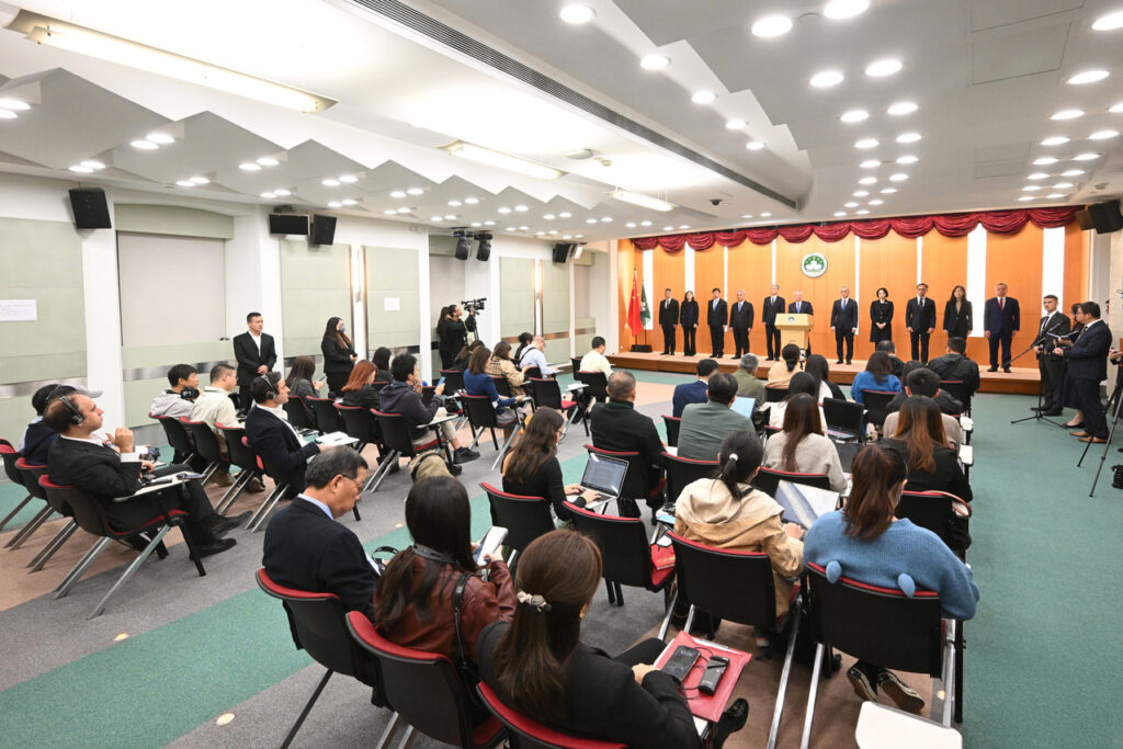 The 10 principal officials of Macao’s sixth-term government stand on stage at their inauguration ceremony, with Chief Executive Sam Hou Fai at their centre