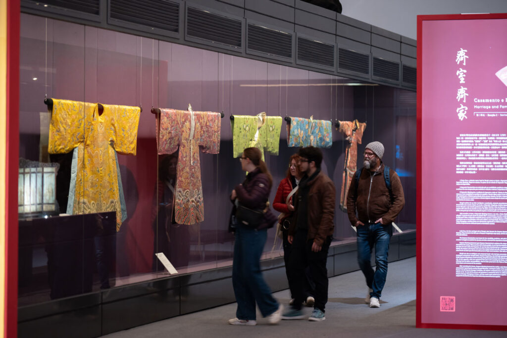 Visitors admire a selection of opera costumes on display in the exhibition, testement to Emperor Qianlong’s appreciation of the art form – a passion he shared with his mother