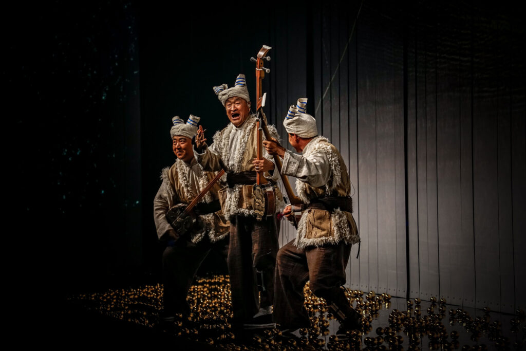 Storytellers from northern Shaanxi Province salute the crowd in the show’s closing act