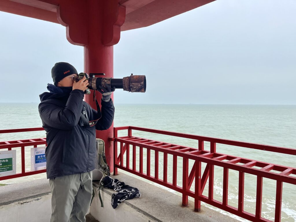 The right equipment makes it possible for Ken Kwan to monitor dolphins from land