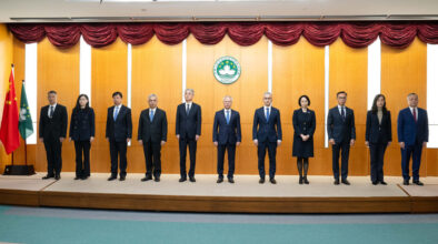 The 10 principal officials of Macao’s sixth-term government stand on stage at their inauguration ceremony, with Chief Executive Sam Hou Fai at their centre