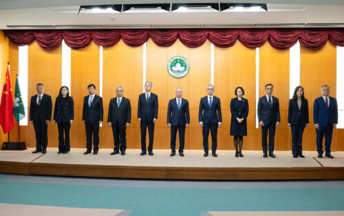 The 10 principal officials of Macao’s sixth-term government stand on stage at their inauguration ceremony, with Chief Executive Sam Hou Fai at their centre