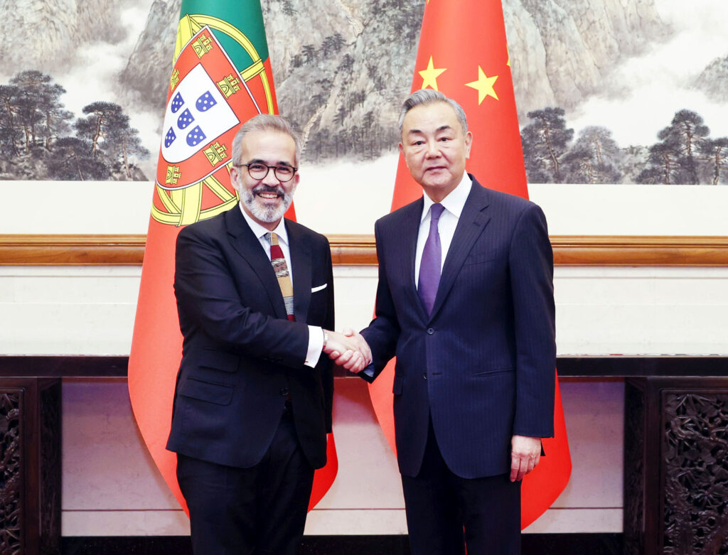 Member of the Political Bureau of the CPC Central Committee and Minister of Foreign Affairs Wang Yi shakes hands with Portugal’s Minister of State and Foreign Affairs, Paulo Rangel, during a meeting in Beijing