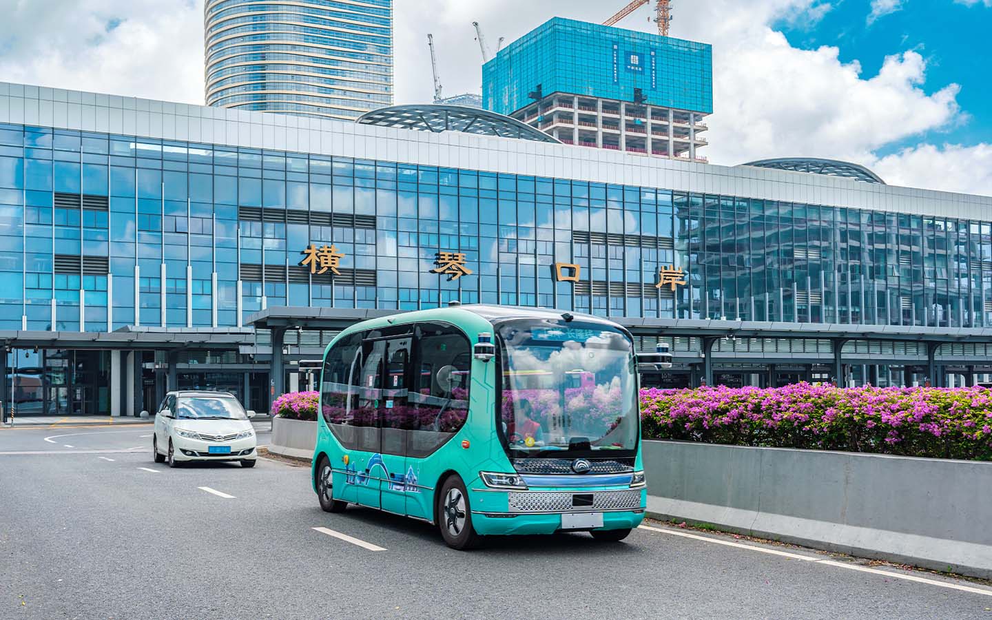 Hengqin is currently testing robobuses that operate without steering wheels, marking a new level of autonomy for public transport in the city