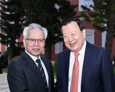 Macao Chief Executive Sam Hou Fai (left) warmly greets visiting Central Government official Xia Baolong outside Santa Sancha in May