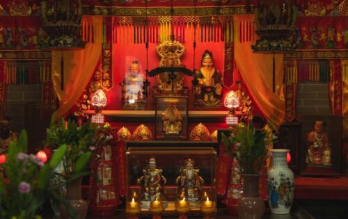 An alter dedicated to the worship of Tou Tei (the bearded figure on the left) and his consort, Tuo Tei Po