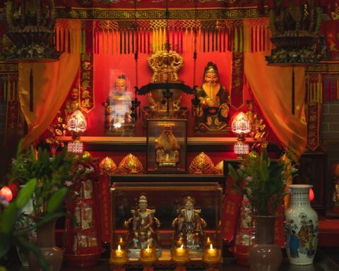 An alter dedicated to the worship of Tou Tei (the bearded figure on the left) and his consort, Tuo Tei Po