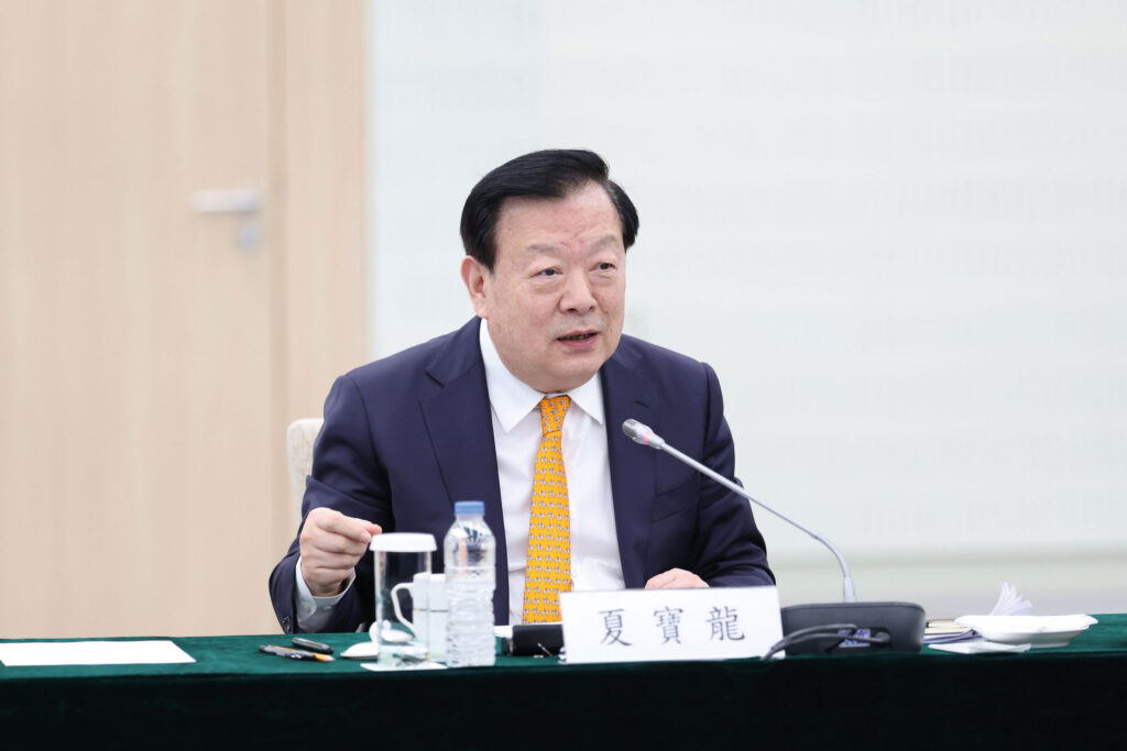 Xia during a meeting with representatives of Macao's industrial and commercial sectors