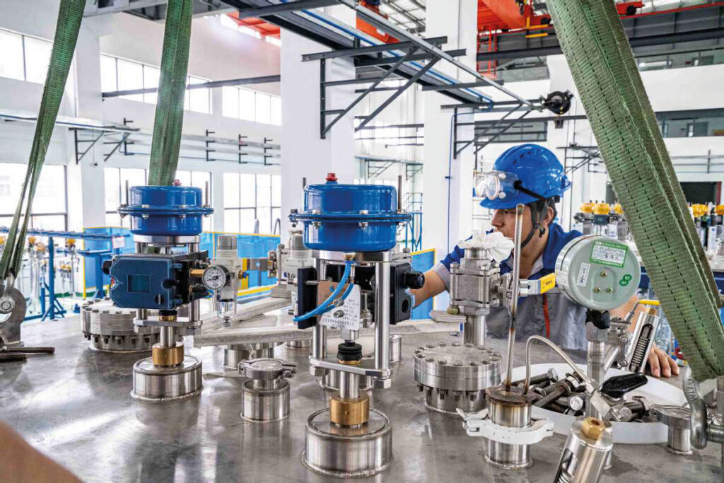 Household appliances are a major Zhongshan export. Here, a factory employee works on the production line for a model of helium refrigerator