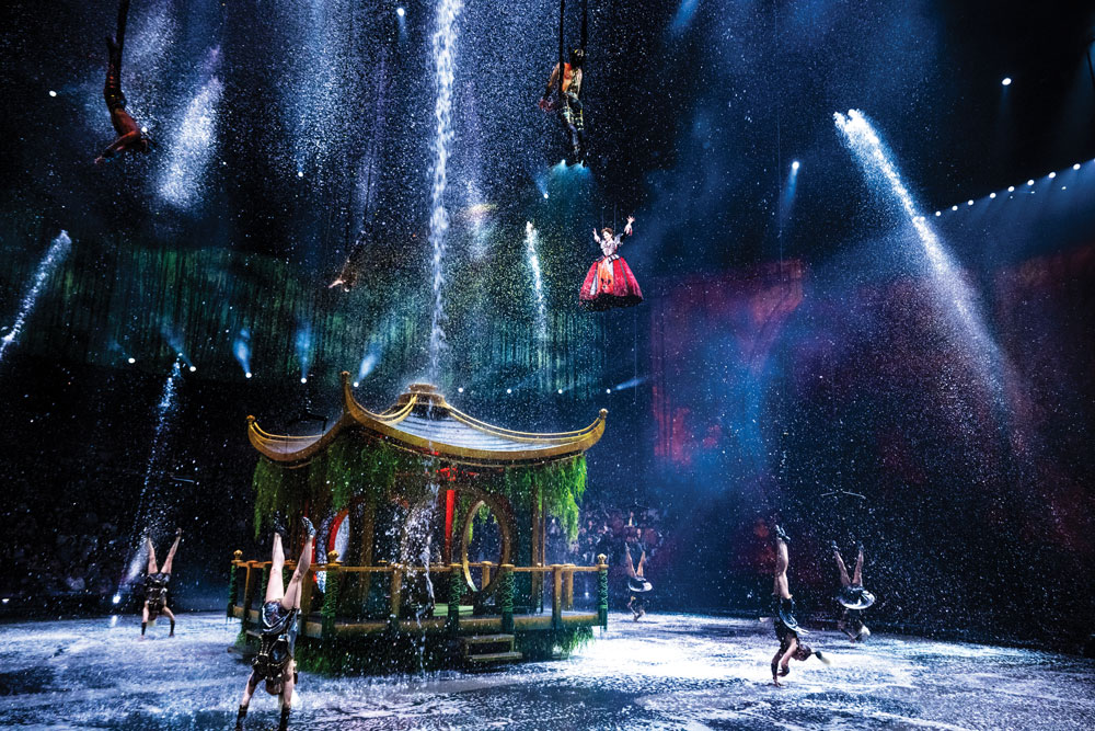 Water is an integral part of the production: not only does it form the stage for much of show, it also falls from the theatre’s ceiling