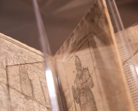 One of many printed treasures in the “Regarding Books” exhibition is a 1566 edition of the Benoît Bible, once deemed heretical by the Catholic Church