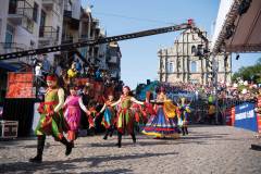 Performers head through the streets in the parade, with the Ruins of St Paul’s in the background. The parade celebrated the 20th anniversary of the SAR and spread the concepts of ‘love, peace and cultural integration’ | Photo by Xinhua News Agency