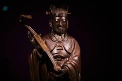 Crisp details mark this bronze abstinence figurine from the Qing dynasty