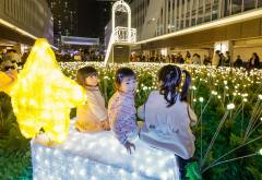 Joy and wonder fill the air as children explore the radiant magic of the shimmering city
