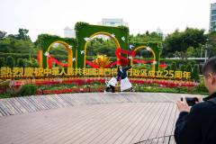 One family captures a fun photo in front of a celebratory display