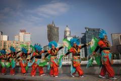 Colourfully dressed Sinulog performers are seen against the unmistakable backdrop of Macao’s skyline