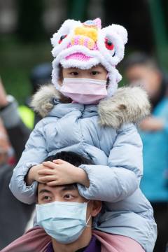 Parade spectators had to present their valid Macao Health Code, scan the contact-tracing QR code