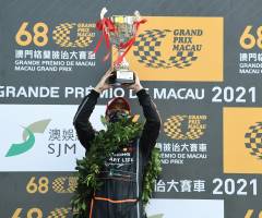 Gleaming with pride, Leong holds up his 68th Macau Grand Prix trophy