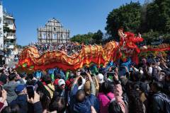 New traditions meet old ones as parade goers tried to snap a picture of the 238-metre dancing dragon with their phones