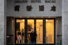 Pondering the past. A guest enjoys a reflective moment at the door of the Grande Hotel