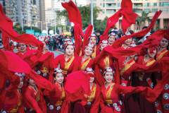 Female performers are dressed in red for the International Parade, which included people from countries and regions along the Belt and Road as well as local artists | Photo by Xinhua News Agency
