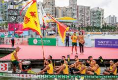 The final day of the races on 25 June was the actual Dragon Boat Festival. This was the big day on the water and included the 500-metre Macao Standard Dragon Boat Race. Here, a team is waved on by supporters on the shore