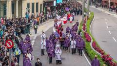 Catholics turn out in the thousands to see the procession wend its way through the historic centre of Macao