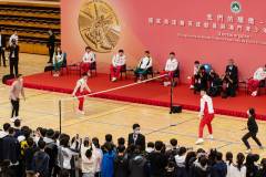 Gold medallists Huang Dongping and Wang Yilyu showcase their badminton skills with local athletes