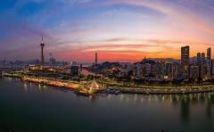 Macao peninsula’s Nam Van Lake and Macau Tower slowly come alive at nightfall.
