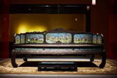 A red sandalwood bed inlaid with painted enamel from some time during the Qing dynasty. The date it was made is not known.