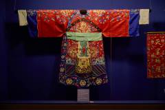 Designated for the ‘dance of promotion’, this red satin python robe is embroidered with cloud and dragon designs