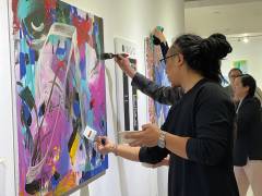 Guests attending the launch event of Amagao Gallery’s one-year anniversary exhibition were given the opportunity to add a touch of colours on a painting